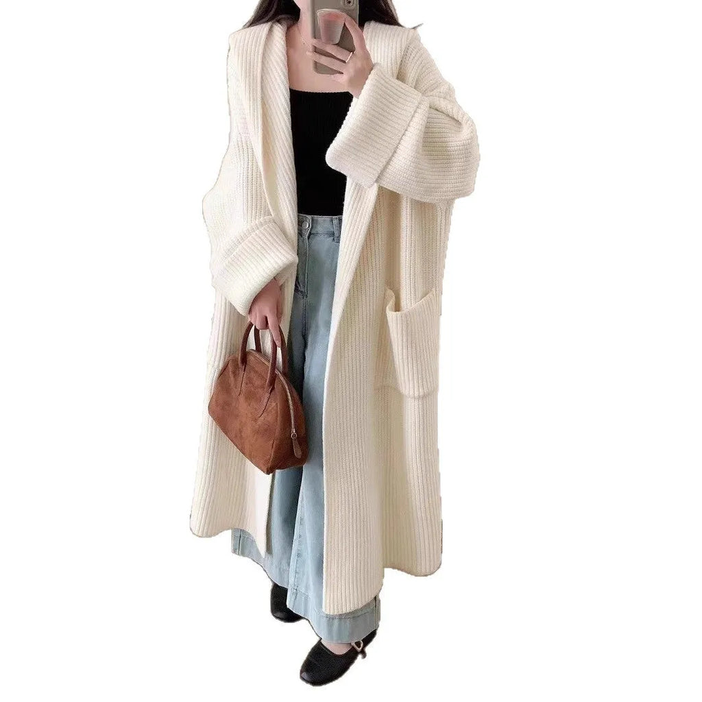 Loose hooded cardigan coat with raglan sleeves in acrylic fabric showing extended length