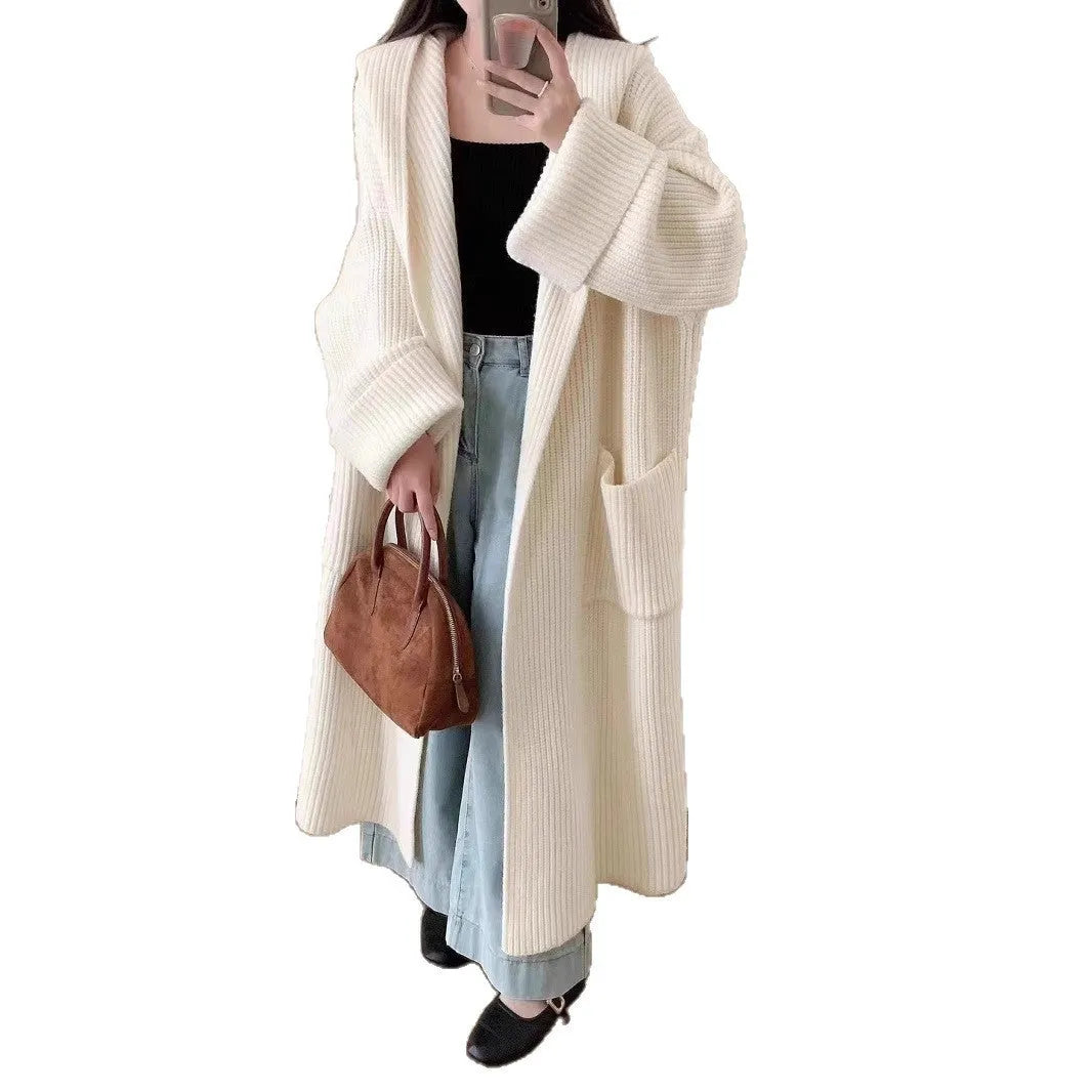 Loose hooded cardigan coat with raglan sleeves in acrylic fabric showing extended length