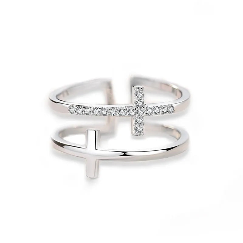 Women's geometric adjustable copper ring with sterling silver and zircon inlay on a hand.