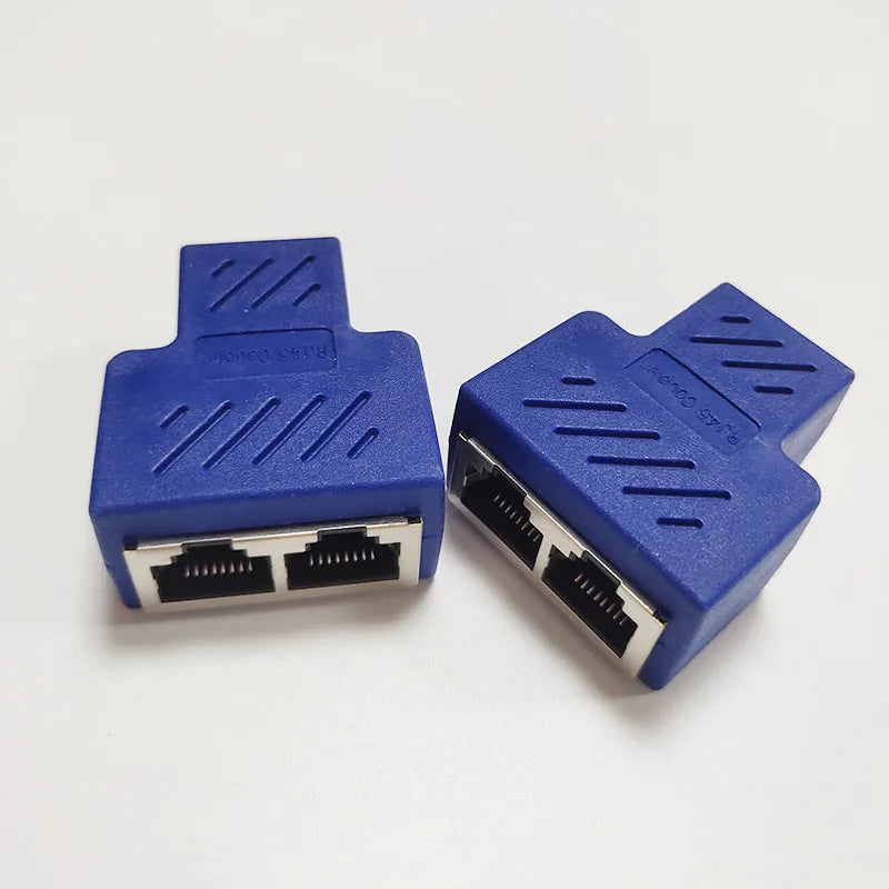 Two white RJ45 network cable splitters, showing one input and two output ports.