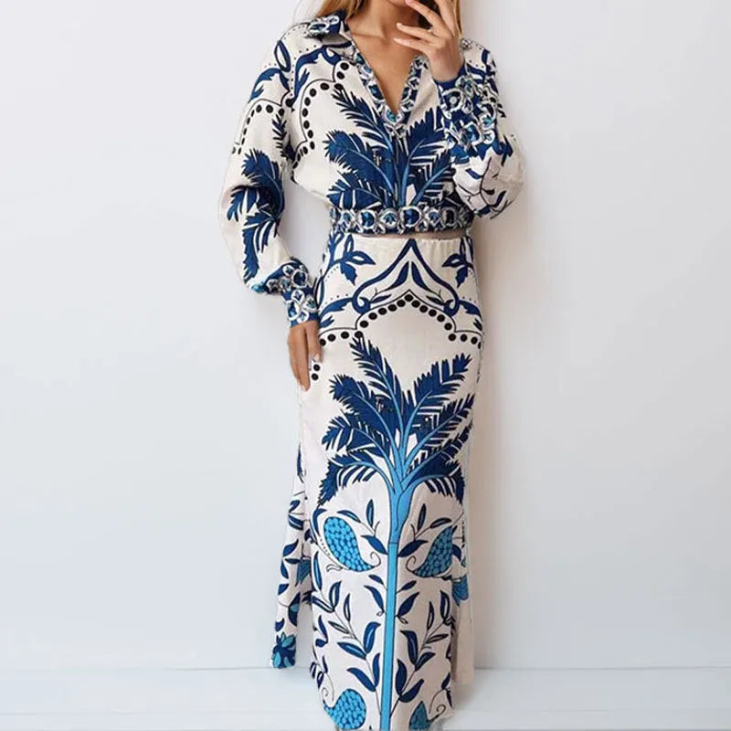Women's casual floral print two-piece set with long sleeve top and long skirt on a hanger.