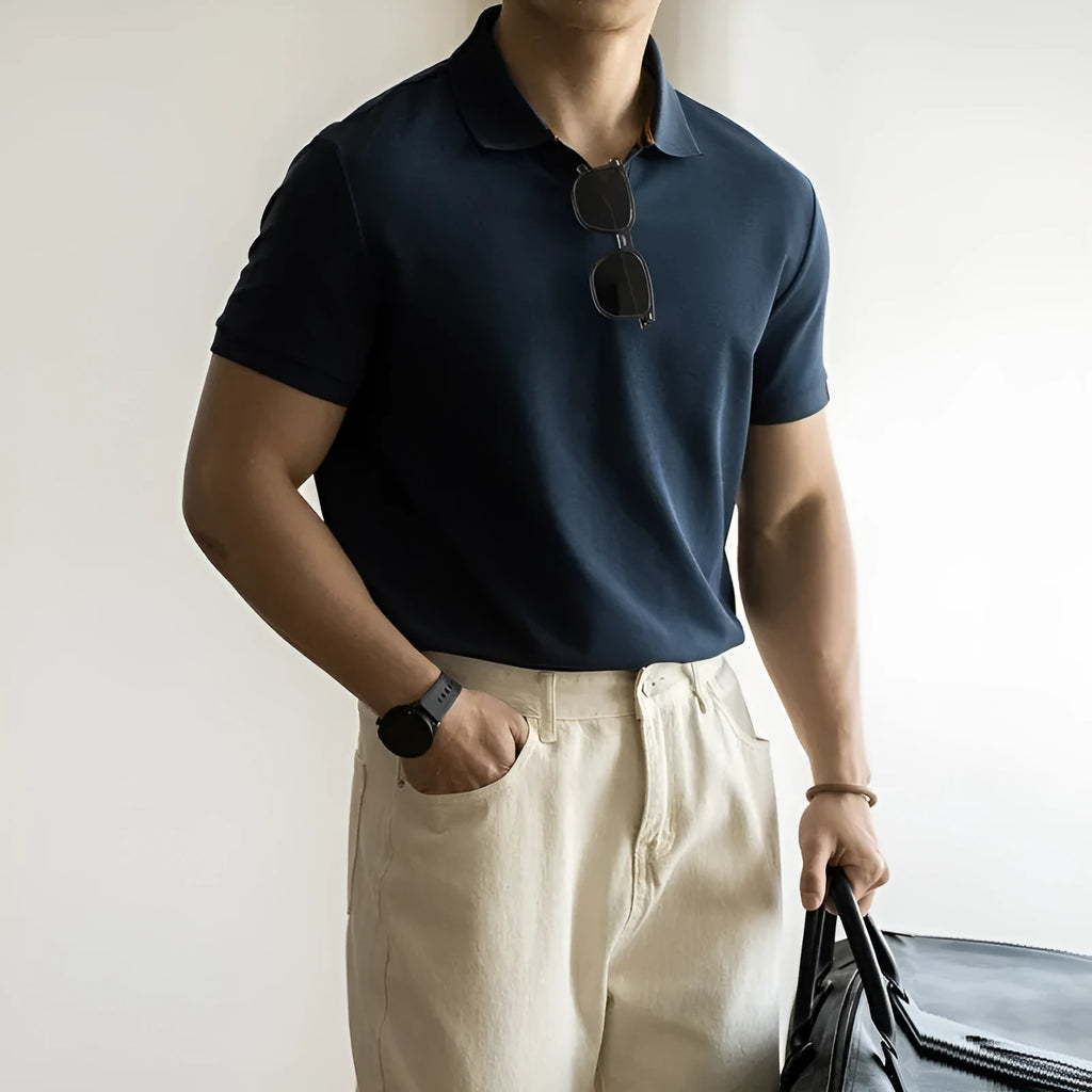 American-style cotton blend short-sleeved polo shirt in blue, shown in a regular fit for casual summer wear.