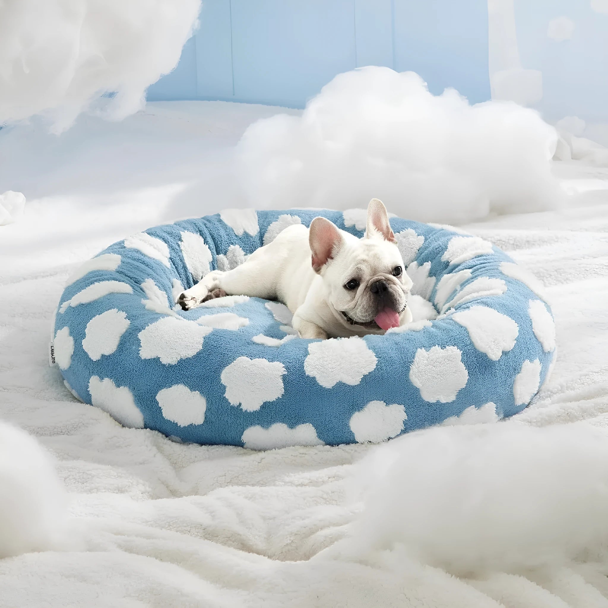 Round plaid dog bed with plastic base, shown in sea blue and white colour, with removable washable cover.