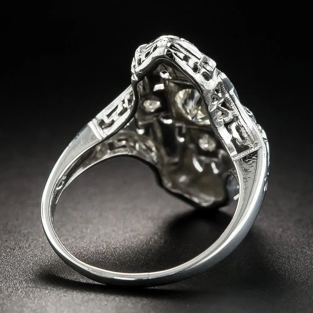 Geometric hollow out silver ring with diamond studs on a copper base.