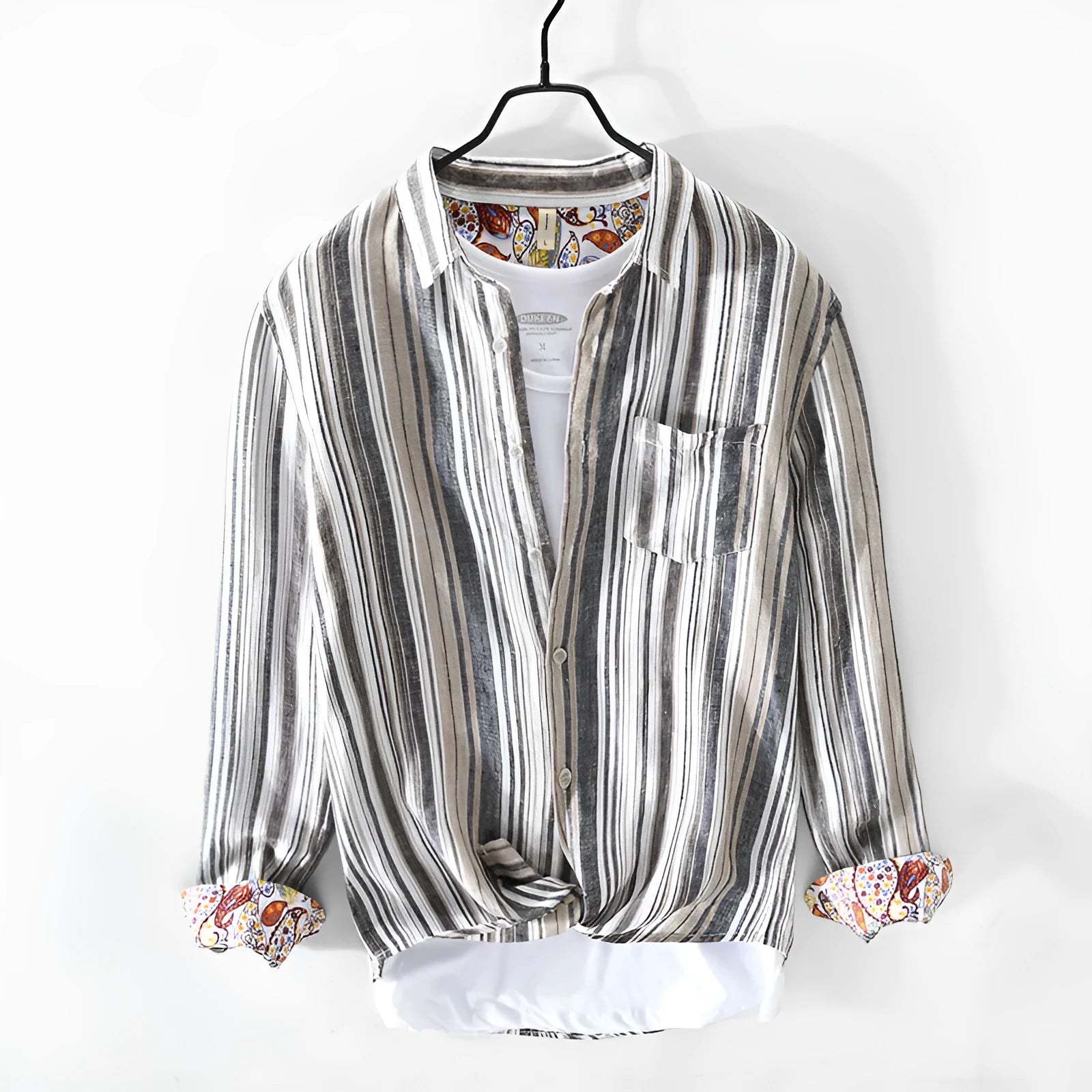 Man wearing a loose-fit red and grey striped linen long-sleeve casual shirt.