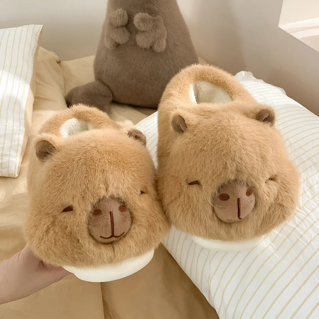 Light brown women's winter slippers with plush cotton upper and cartoon pattern.