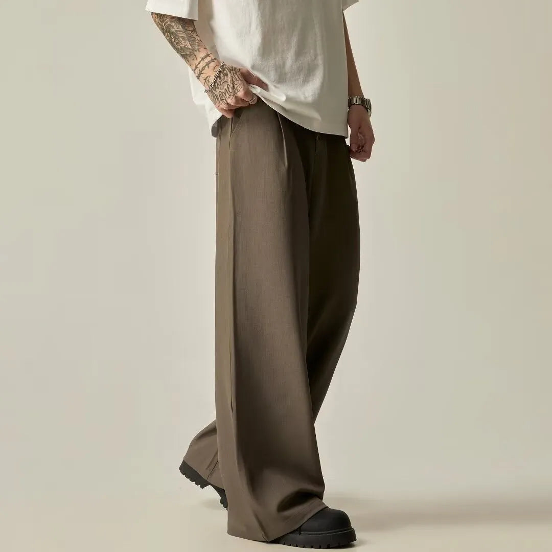 Men's solid colour polyester casual trousers with wide-leg design and elastic mid waist