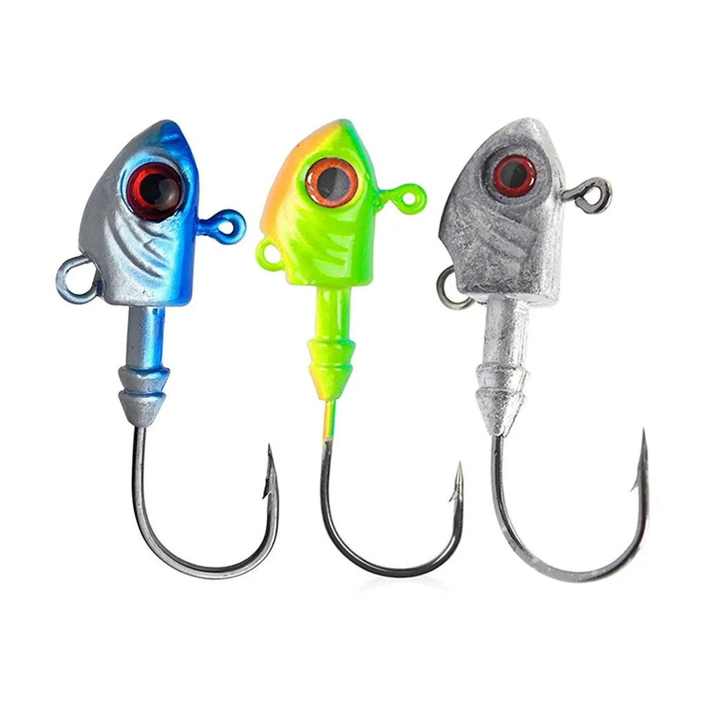 Three yayu shaped lead fishing jig hooks in different weights and colours on a blue background.