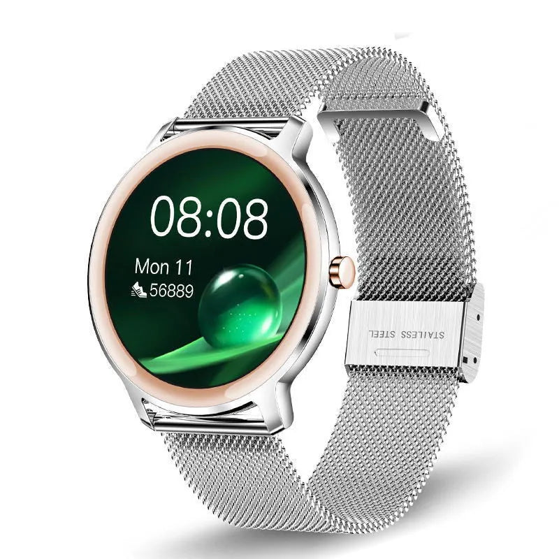 Women's silver mesh smart watch with 1.3-inch touchscreen displaying time, shown on a wrist.