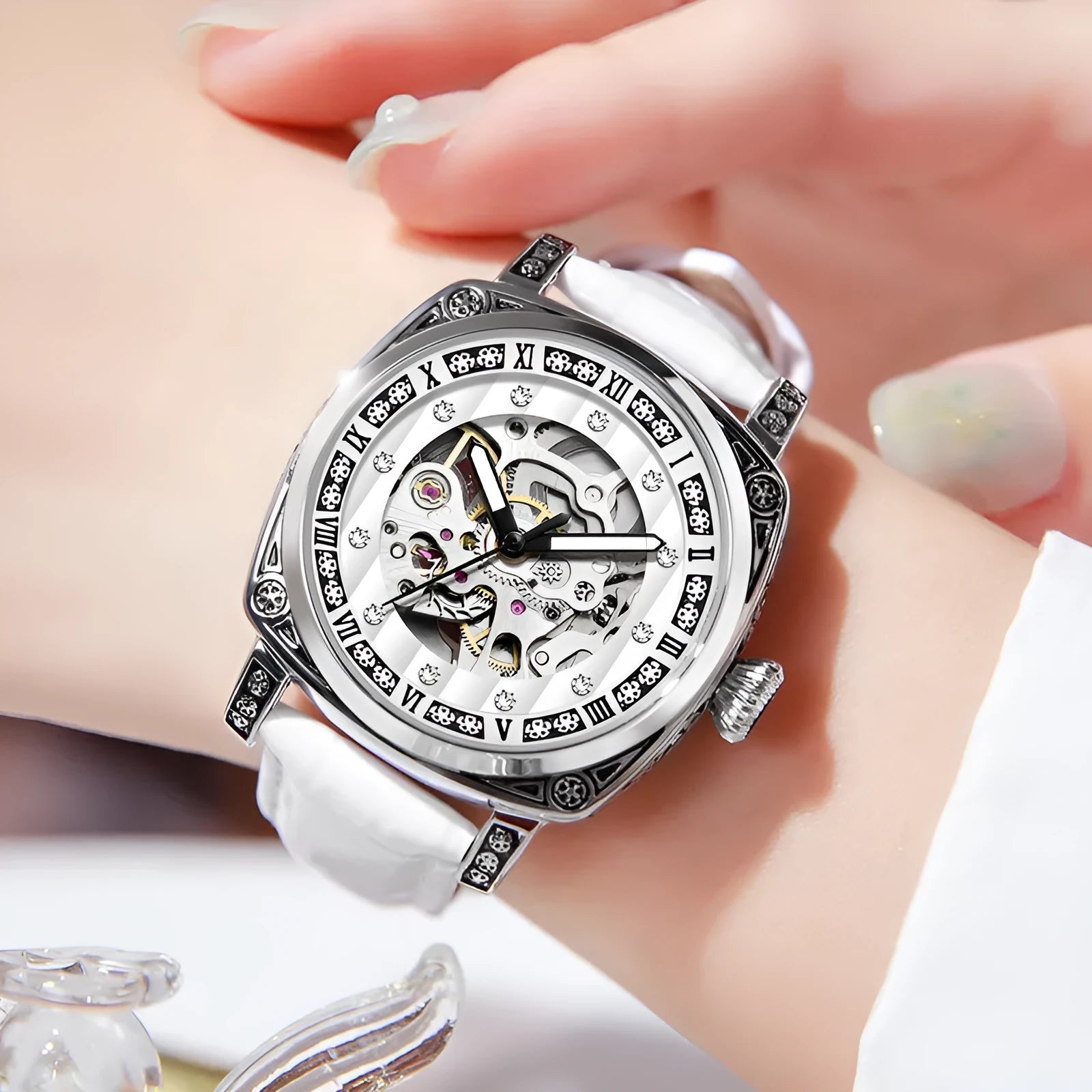 Mechanical watch with luminous hands and a leather strap, shown in various dial colour options.