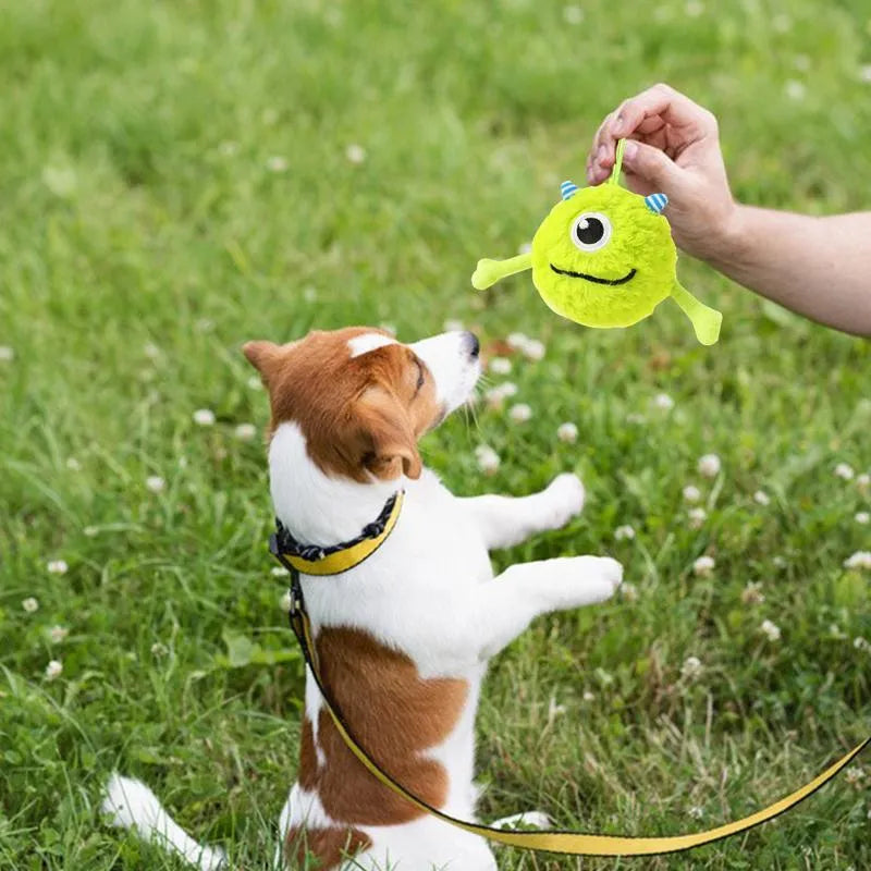 Green interactive dog toy ball with sound activation feature for teething and teeth cleaning