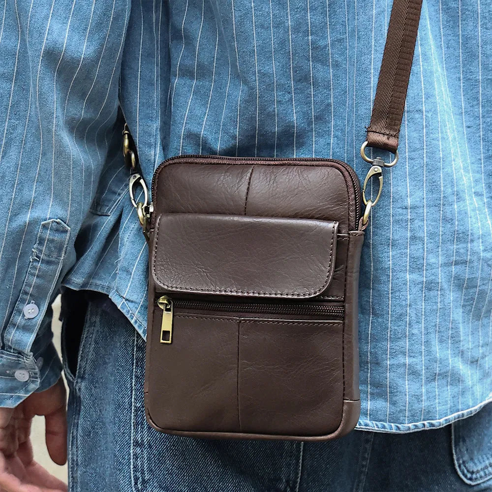 Men's brown genuine leather crossbody shoulder bag with visible stitching and a solid colour design.