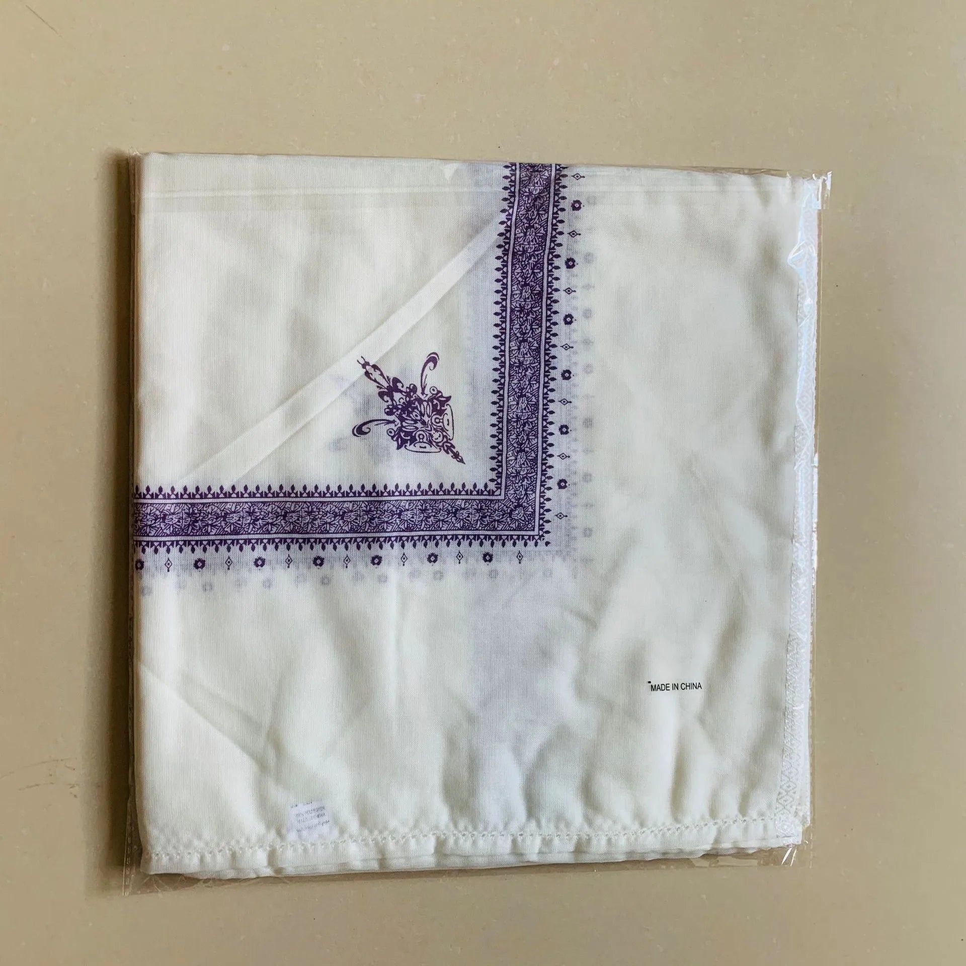 Printed square polyester scarf in a selection of colours, shown flat to display its 138x138 cm dimensions.