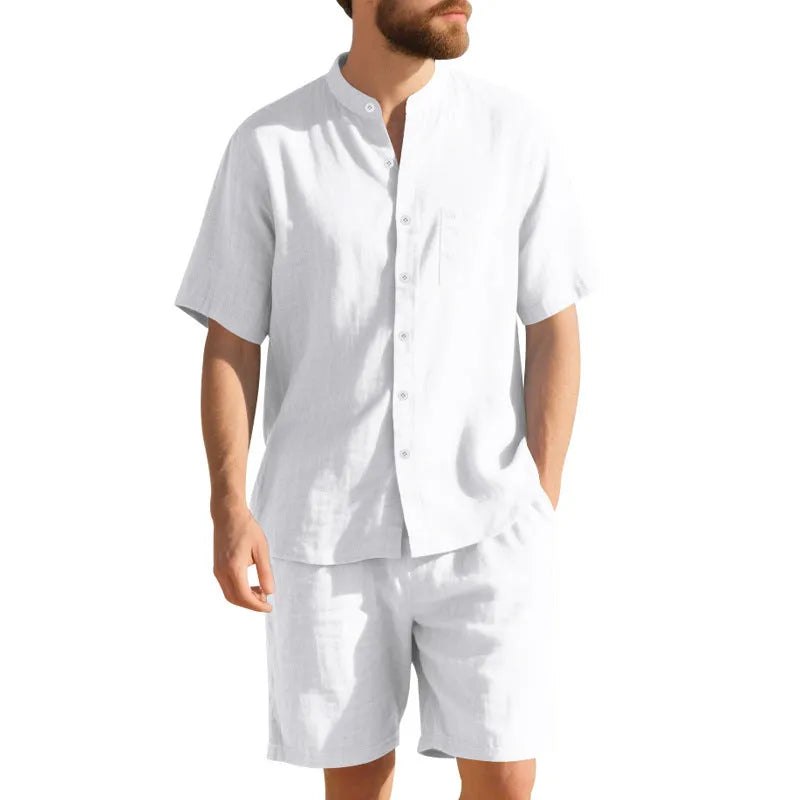 Men's light blue linen two-piece suit with short-sleeved henry collar shirt jacket and shorts on a hanger.