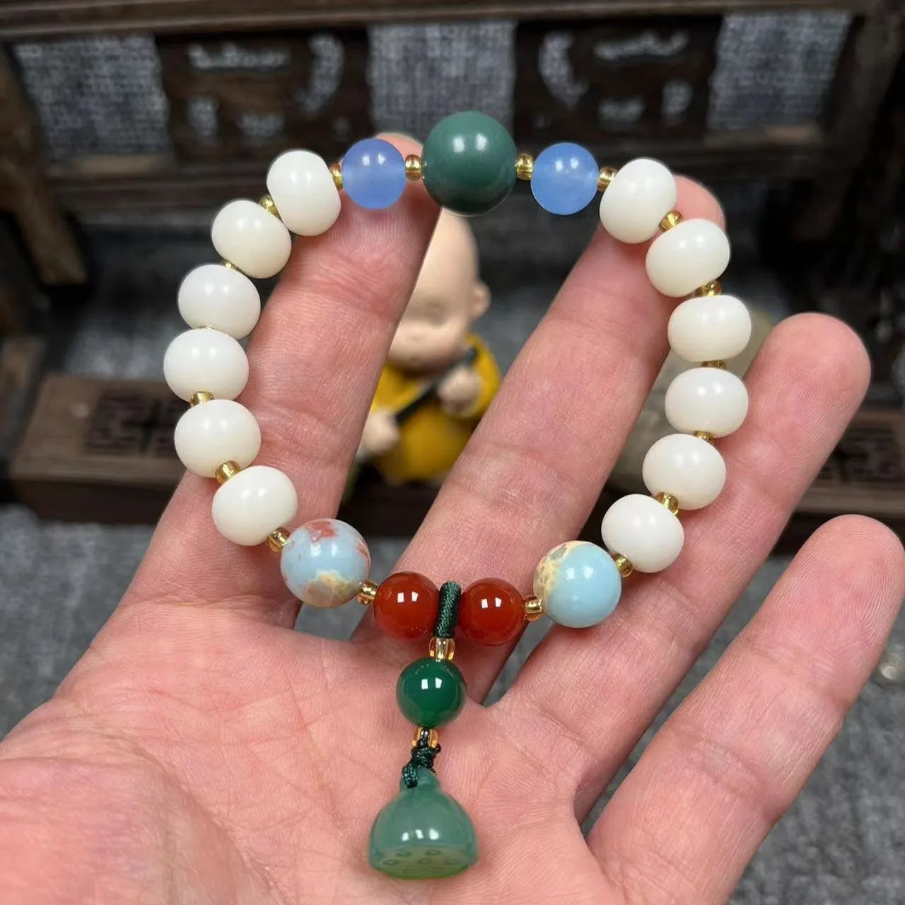 Carved bodhi root pumpkin lotus bracelet with white jade beads and mixed sizing