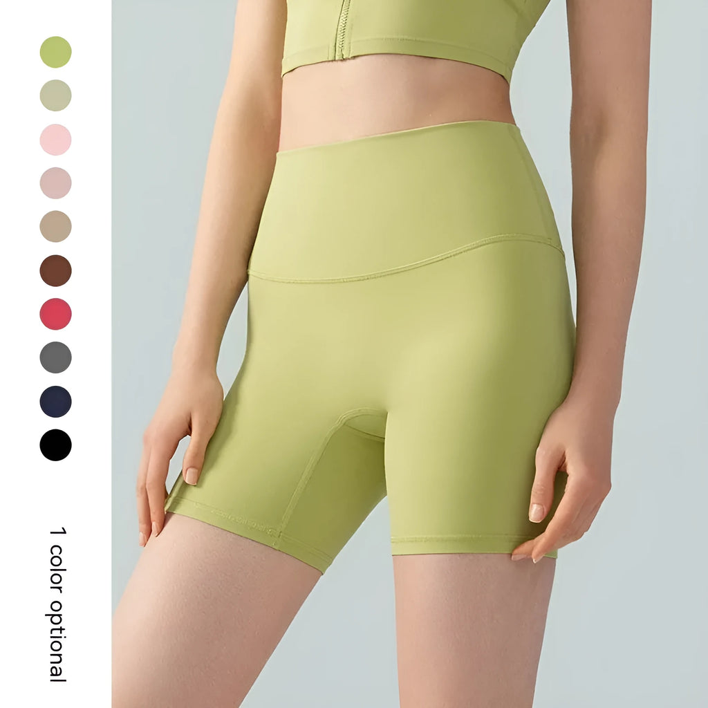 Women's high waist Lycra yoga shorts in leaf green colour, shown as short-length fitness pants.
