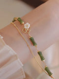 Natural green Olivine double layer bracelet with Twin Bells of Ireland and Olive Branch charms.