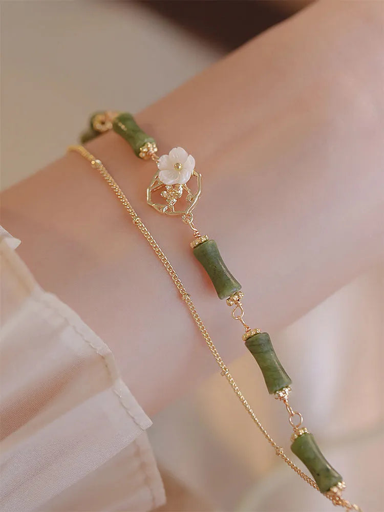 Natural green Olivine double layer bracelet with Twin Bells of Ireland and Olive Branch charms.