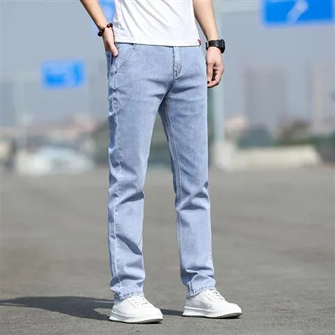 Men's straight leg jeans in smoky gray colour with low waist and zipper fly closure