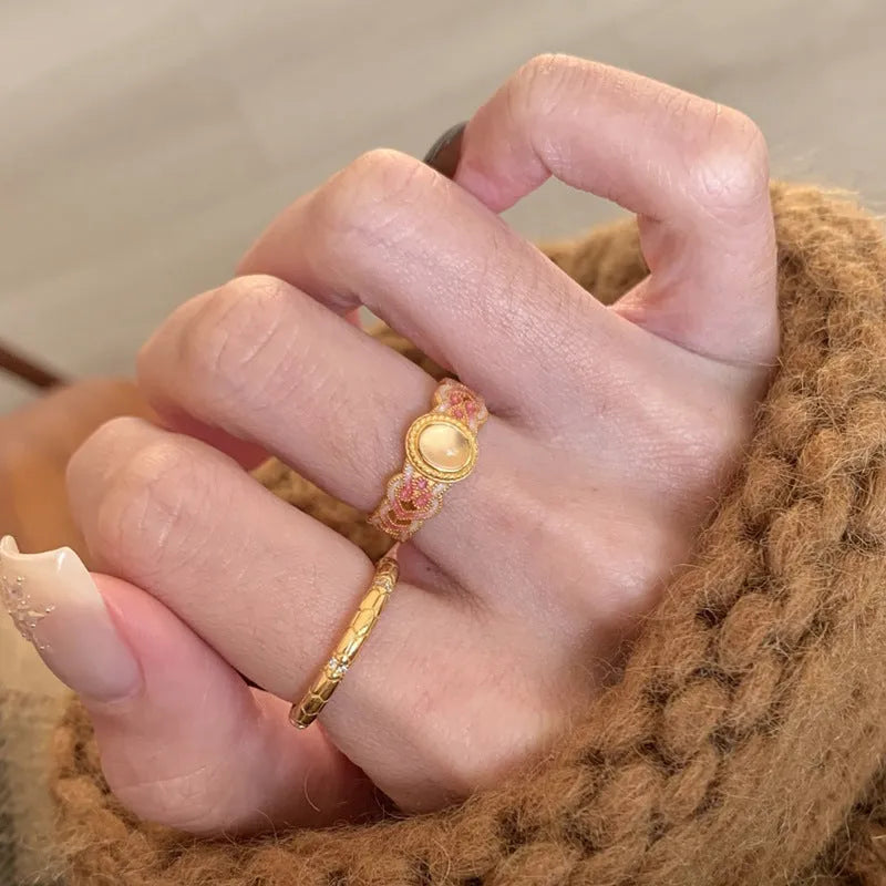 Women's pink crystal enamel adjustable ring with geometric open design on gold-plated copper