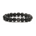 Volcanic rock agate bracelet with stainless steel geometric charm on adjustable cord.