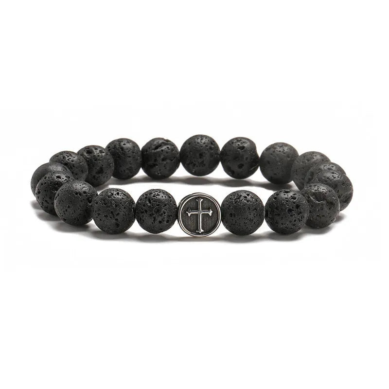 Volcanic rock agate bracelet with stainless steel geometric charm on adjustable cord.