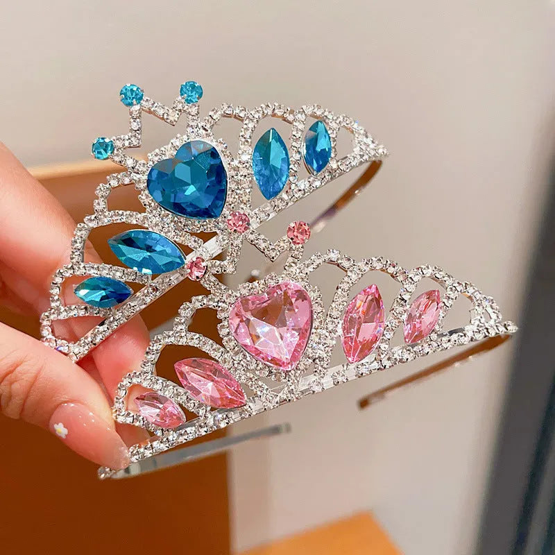 Close-up of a children's metal hairband headdress with a crown pattern in a light purple crystal colour.