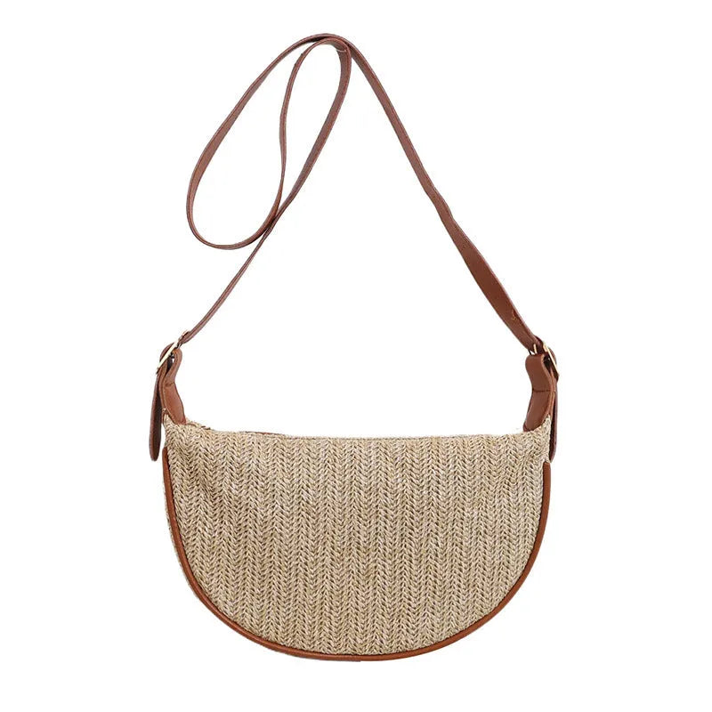 Women's straw woven crossbody bag showing internal mobile phone pocket and file compartment.