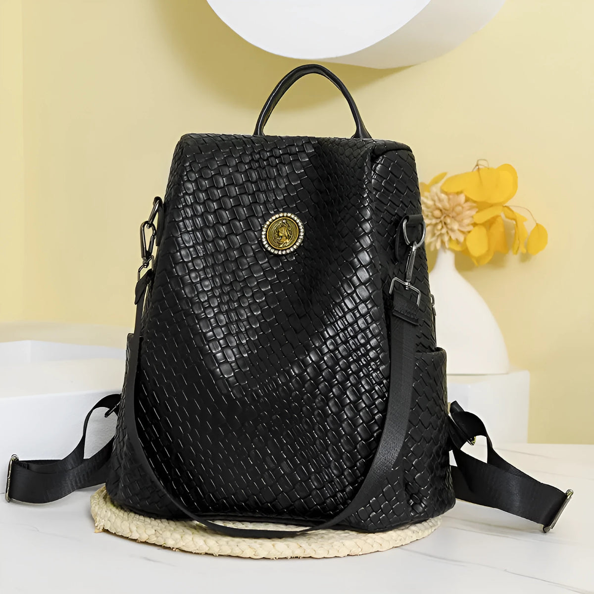 Women's black waterproof anti-theft backpack showing organisational interior compartments