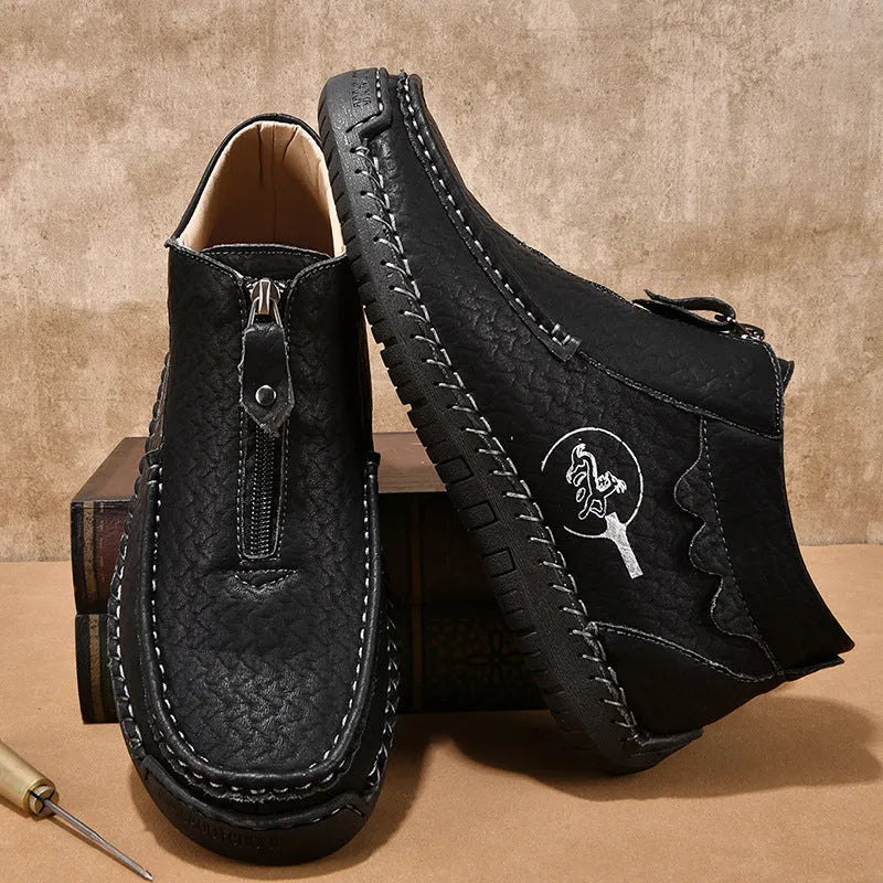 Men's black slip-on loafers with a round toe and rubber sole on a white background.