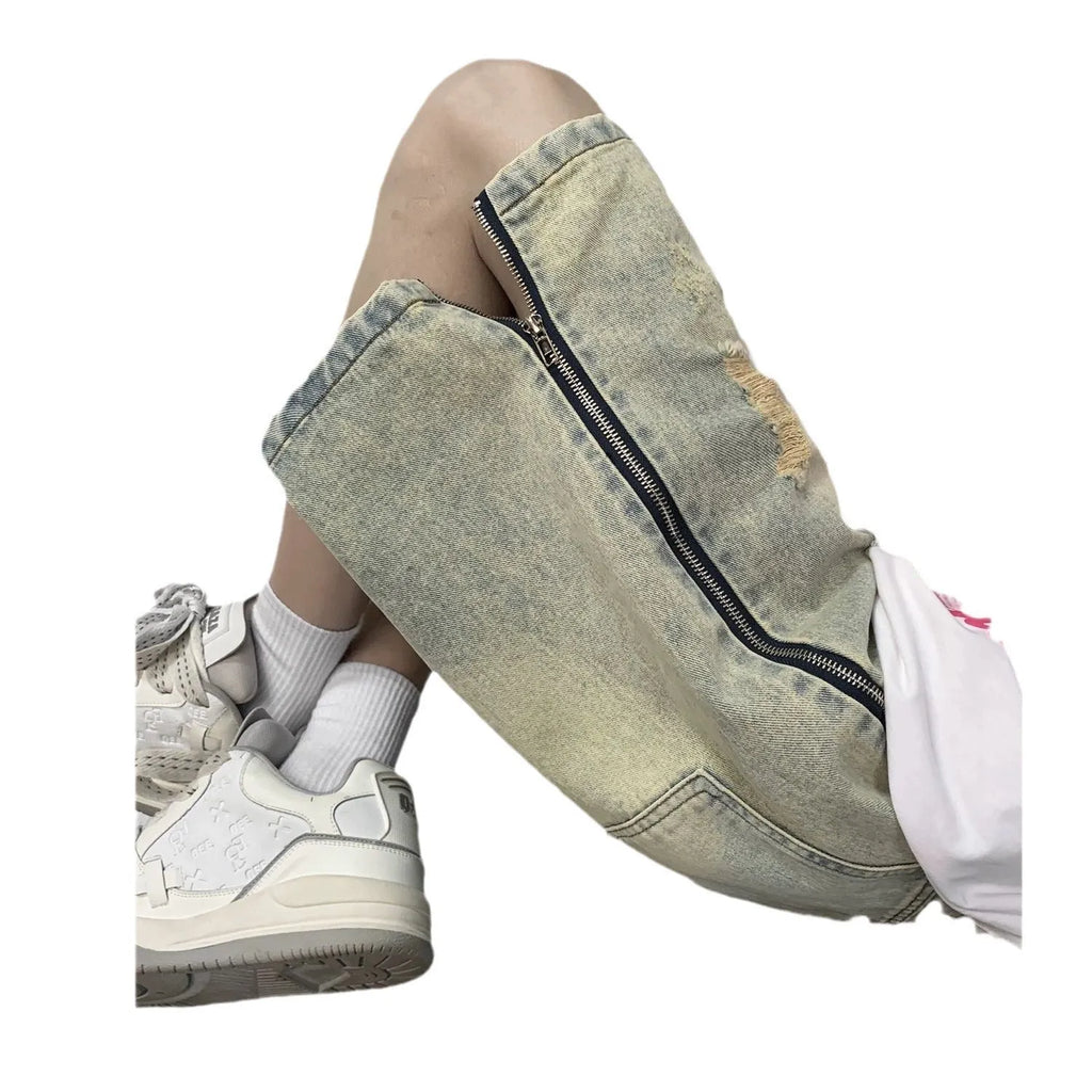 Blue men's loose retro ripped denim shorts with button closure on a straight leg