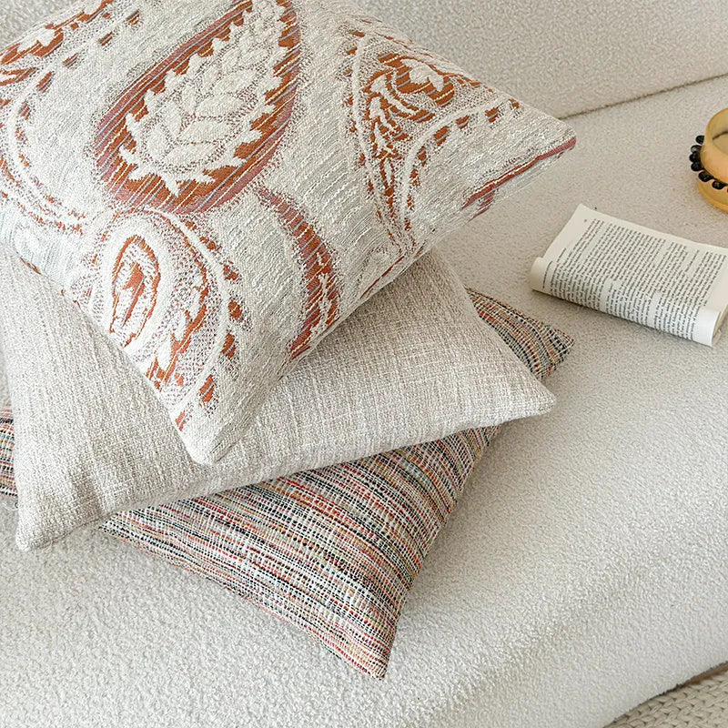 American-style jacquard throw pillow cover with paisley pattern in amber tones, shown in square and rectangular sizes.