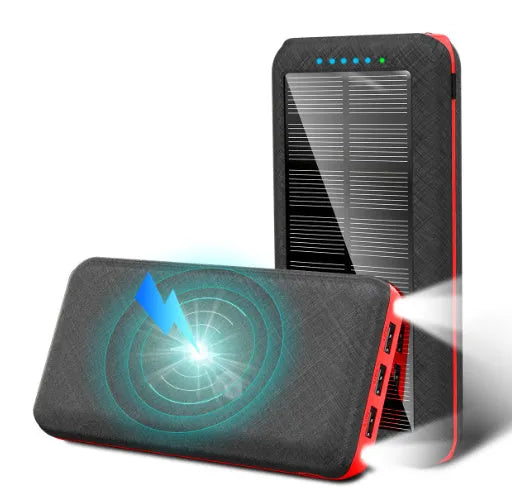 Black portable power bank with wireless Qi charging pad, three USB ports, and LED flashlight