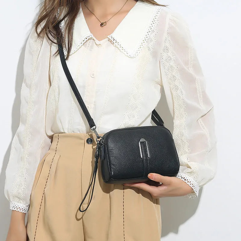 Black genuine leather women's square shoulder bag with a structured horizontal shape
