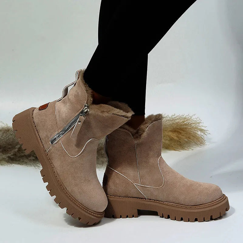 Women's black faux suede high-top snow boots with side zipper and faux fur lining.