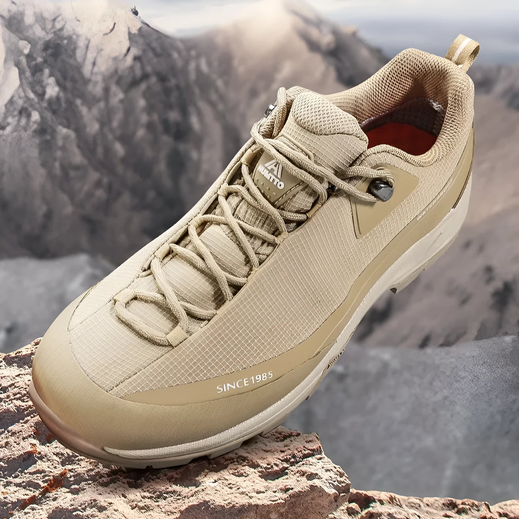 Low-top mountain climbing shoes with leather mesh upper and non-slip rubber sole in black-red and beige-maroon colour options for men and women.