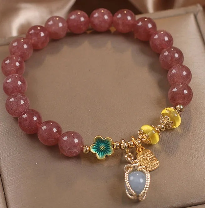 Red women's bracelet with strawberry quartz beads, alloy settings, and sparkling rhinestone details.