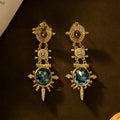 Geometric stud earrings with retro court style, gold colour, and diamond treatment surface