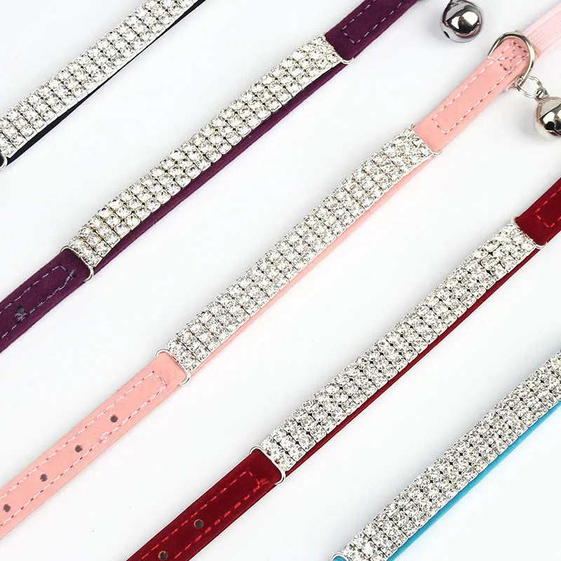Red velvet cat collar with rhinestones, adjustable buckle shown.