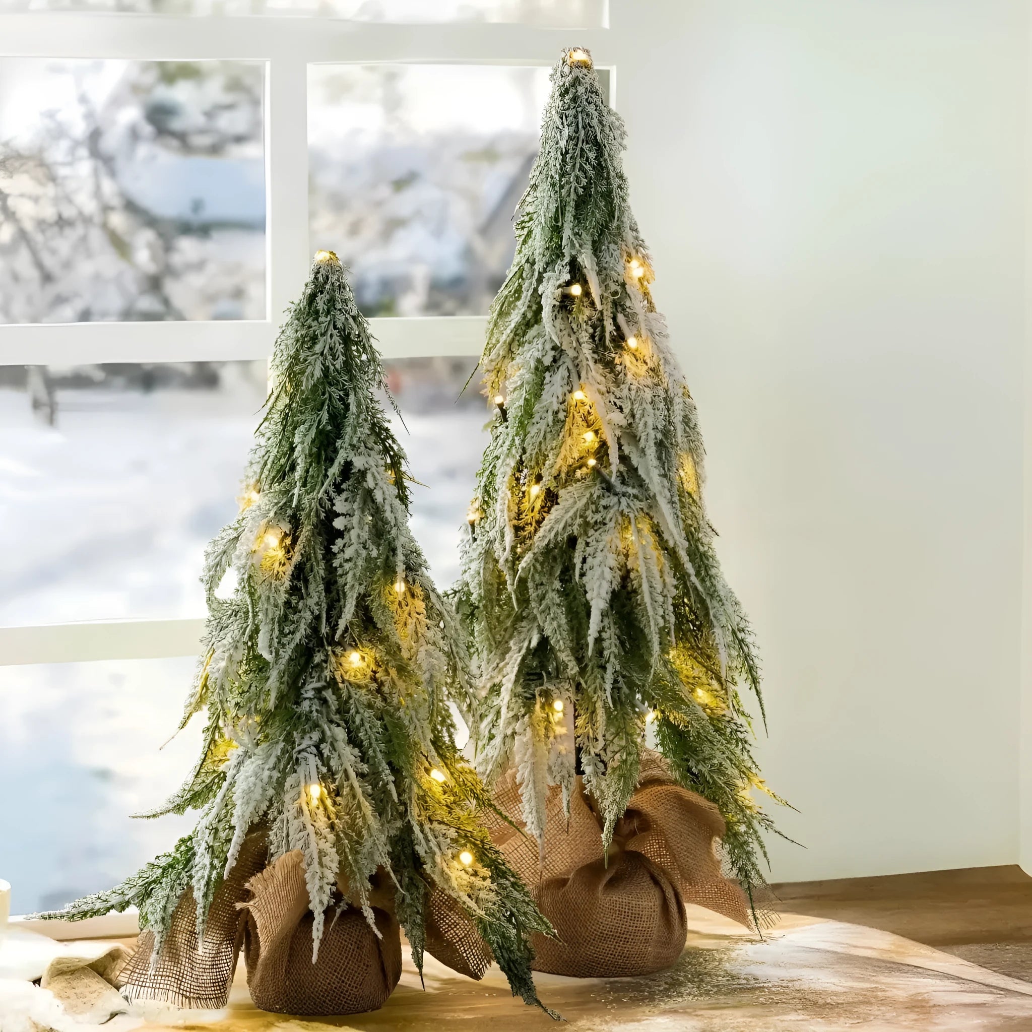 24-inch white snowy plastic desktop Christmas tree with built-in lights and one ornament.