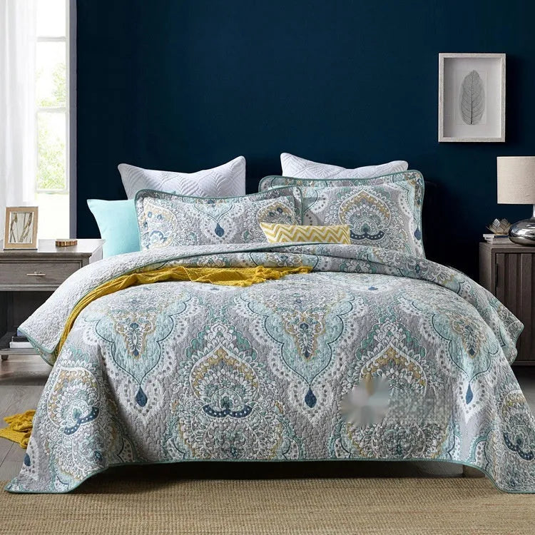 Quilted cotton bed cover set with printed pattern including bedspread and two pillowcases