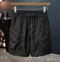 Men's camouflage cargo shorts in cotton blend fabric with loose fit and cargo pockets
