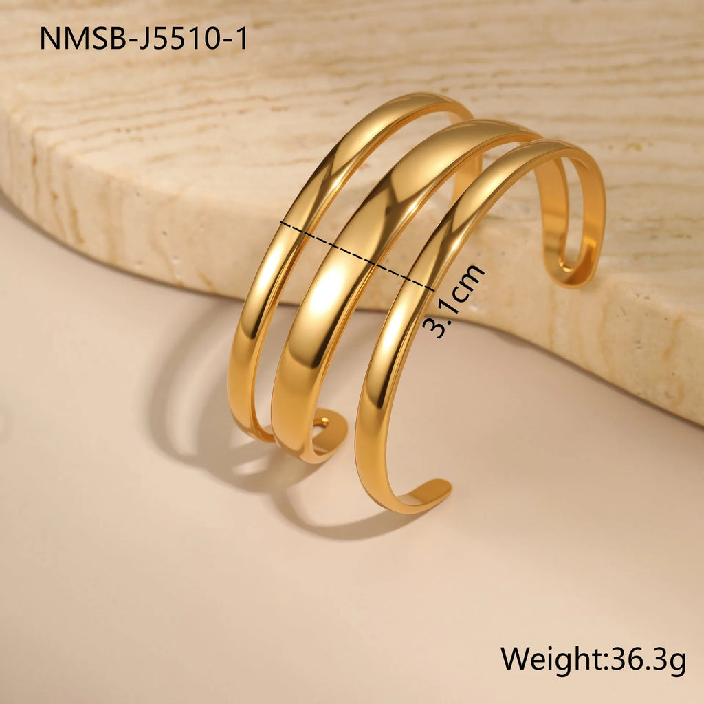 Geometric line stainless steel bracelet for women in gold tone or steel finish.