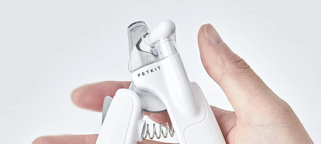 White pet nail clippers with LED light, anti-splash guard, and leather-like handle.