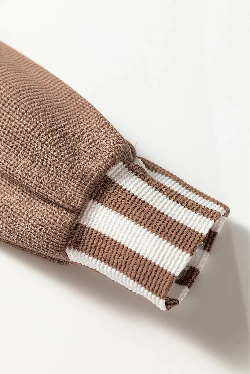 Straw yellow waffle texture hoodie with patchwork stripes, drawstring hood, and button neck detail