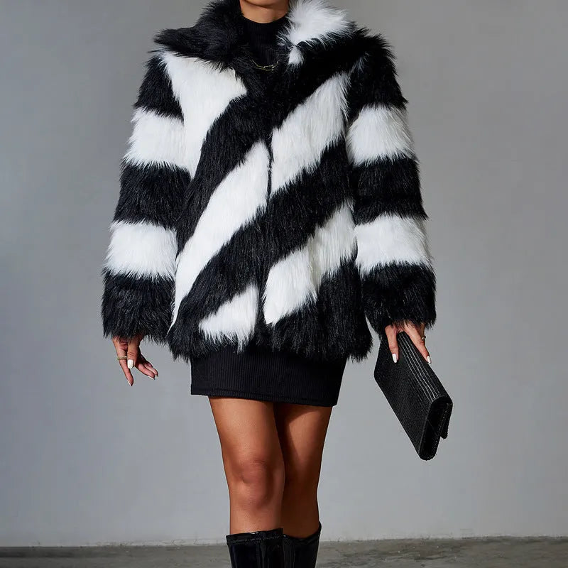 Picture Colour faux fur coat with dark contrast lapels and a matching fur collar.