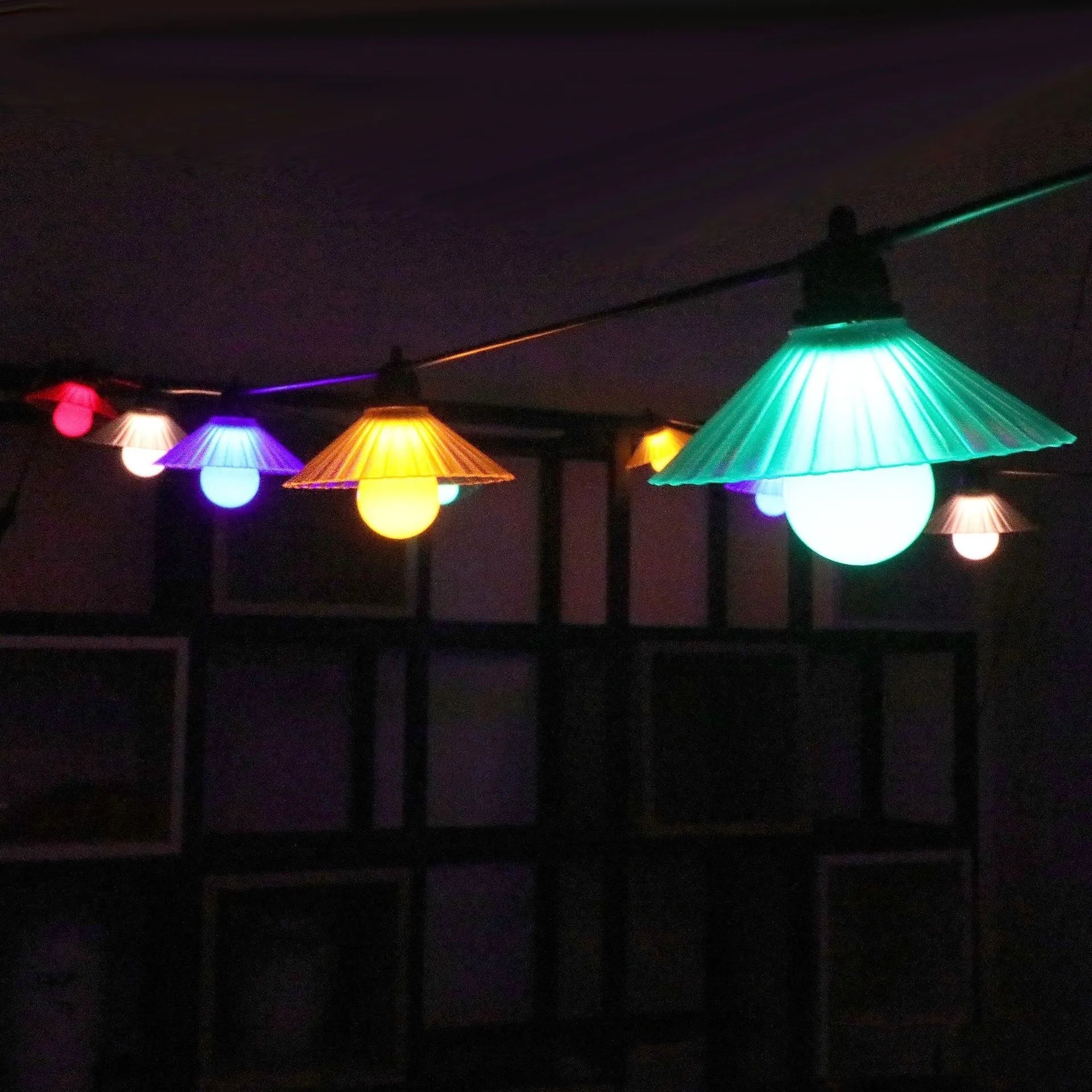 Outdoor LED string lights with flower-shaped globe bulbs in warm white or multicolour options
