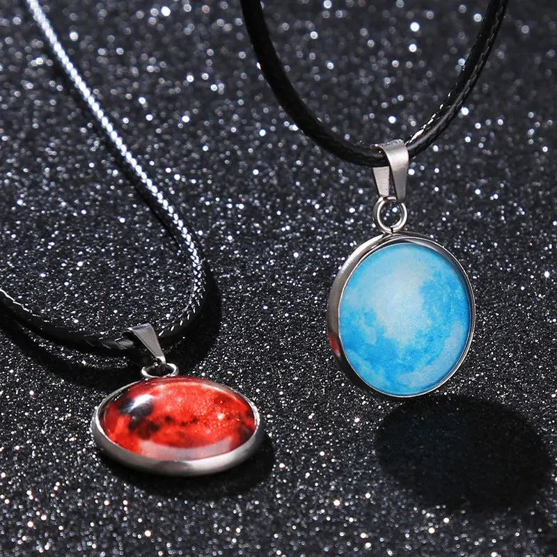 Christmas moon and night sky luminous constellation pendant on a glass necklace chain.