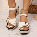 Women's black chunky heel sandals with metal buckle and square toe design on rubber sole