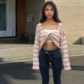 Women's black and white striped long-sleeved sweater with exposed navel front and back design.